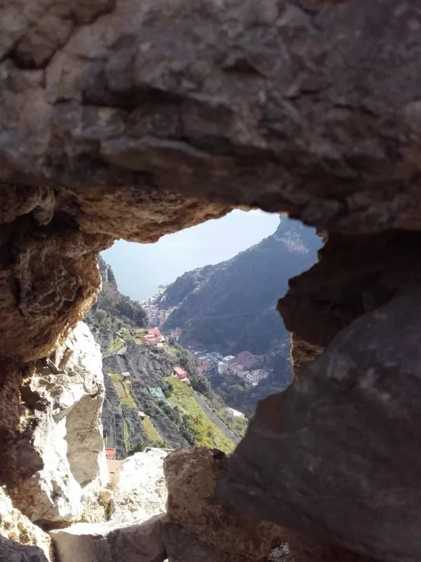 View through stone ruins toward Scala