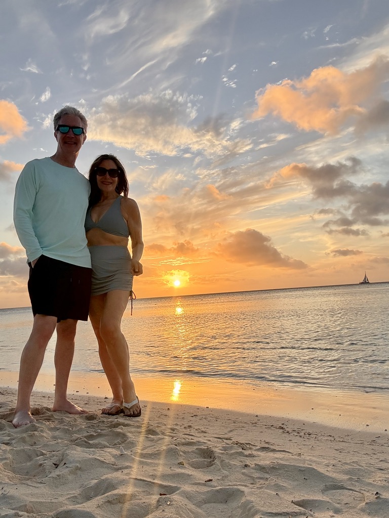 Robin and Darin on the beach at sunset
